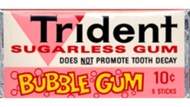 1972 package of trident sugarless gum - bubble gum flavour. Pink and white packaging that states "does not promote tooth decay"